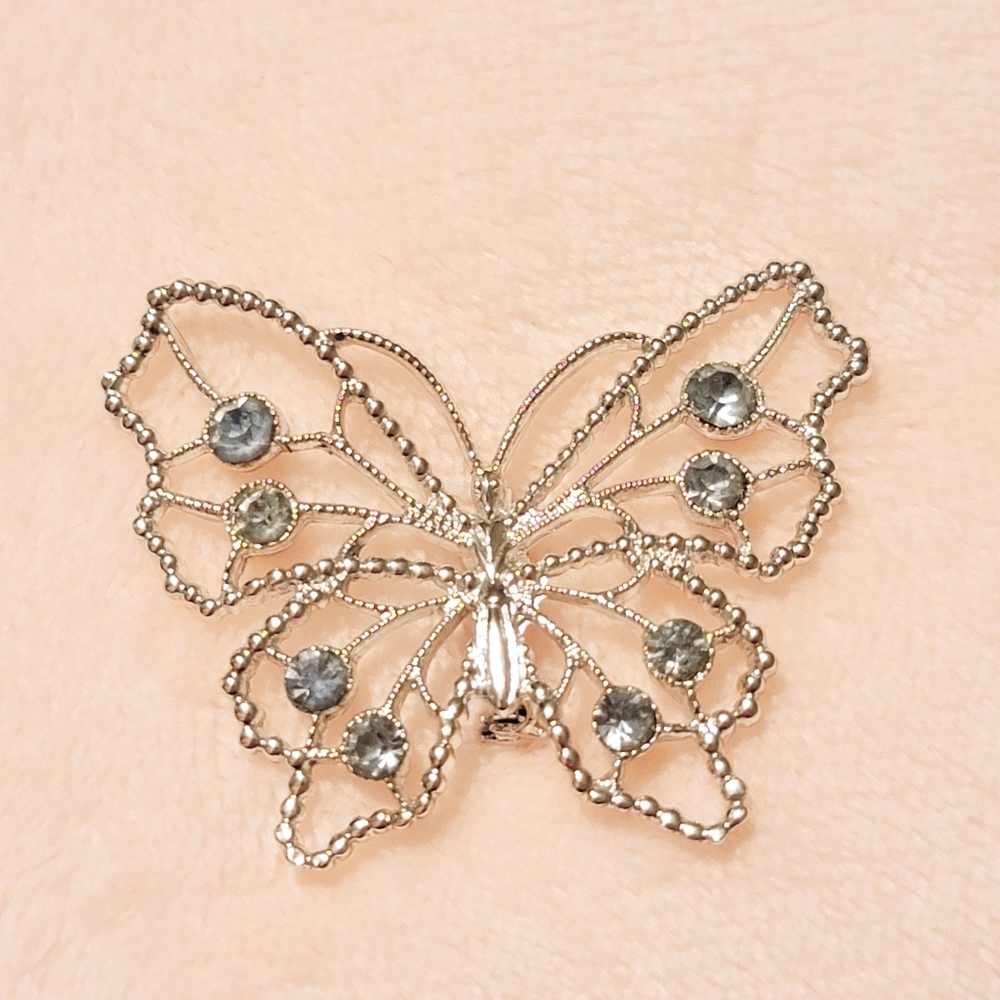 Silver 🦋 Butterfly pin w/ Aquamarine rhinestones.